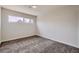 Simple bedroom with carpet flooring and large window at 5129 Del Monte Ave, Las Vegas, NV 89146