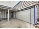 Attached garage with a white overhead door and concrete driveway at 5129 Del Monte Ave, Las Vegas, NV 89146