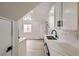 Bright kitchen with white cabinets and quartz countertops at 5129 Del Monte Ave, Las Vegas, NV 89146