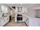 Modern kitchen with white cabinets and quartz countertops at 5129 Del Monte Ave, Las Vegas, NV 89146