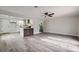 Open living room with kitchen island and hardwood floors at 5129 Del Monte Ave, Las Vegas, NV 89146