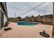 Relaxing rectangular pool with concrete patio and brick steps at 5129 Del Monte Ave, Las Vegas, NV 89146