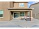 Covered patio with seating area, perfect for outdoor living at 521 Abrazar Ave, North Las Vegas, NV 89081