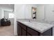 Bathroom with granite countertop and view into living area at 521 Abrazar Ave, North Las Vegas, NV 89081