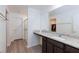 Bathroom boasts granite countertop, large mirror and walk-in shower at 521 Abrazar Ave, North Las Vegas, NV 89081