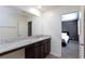 Modern bathroom with granite vanity, and view into bedroom at 521 Abrazar Ave, North Las Vegas, NV 89081