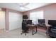 Bright bedroom featuring a workspace and double closets at 521 Abrazar Ave, North Las Vegas, NV 89081