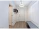 Bright foyer with wood-look floors, bench, and shelving at 521 Abrazar Ave, North Las Vegas, NV 89081