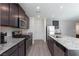 Modern kitchen with stainless steel appliances and granite countertops at 521 Abrazar Ave, North Las Vegas, NV 89081