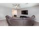 Living room with L-shaped sectional and view of entryway at 521 Abrazar Ave, North Las Vegas, NV 89081