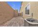 Private backyard patio next to block wall at 5233 Fiery Sky Ridge St, Las Vegas, NV 89148