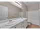 Bathroom with double vanity, large mirror and tub at 5233 Fiery Sky Ridge St, Las Vegas, NV 89148