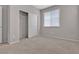 Bedroom with carpeted floor, window blinds, and sliding closet doors at 5233 Fiery Sky Ridge St, Las Vegas, NV 89148