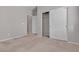 Neutral bedroom featuring carpet and closet with sliding doors at 5233 Fiery Sky Ridge St, Las Vegas, NV 89148