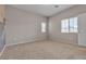 Spacious bedroom with neutral decor and window at 5233 Fiery Sky Ridge St, Las Vegas, NV 89148