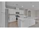 Well-lit kitchen featuring a kitchen island and stainless steel appliances at 5233 Fiery Sky Ridge St, Las Vegas, NV 89148