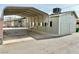 Carport with a metal roof and a view of a house at 624 D Ave, Boulder City, NV 89005