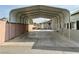 View through a carport, showing a house and wall at 624 D Ave, Boulder City, NV 89005