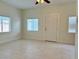 Bright living room with tile floors and white walls at 624 D Ave, Boulder City, NV 89005