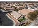 Aerial view of a house with a small backyard and a residential street at 6420 Birdcall St, North Las Vegas, NV 89084