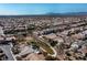 Aerial view of a house nestled in a community with mountain views at 6420 Birdcall St, North Las Vegas, NV 89084