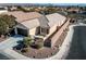 Single-story home with two-car garage and landscaped yard at 6420 Birdcall St, North Las Vegas, NV 89084