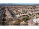 Neighborhood wide aerial view of houses and landscape at 6420 Birdcall St, North Las Vegas, NV 89084