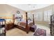 Spacious bedroom with a wooden four-poster bed and a bay window at 6420 Birdcall St, North Las Vegas, NV 89084