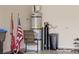 Garage with water heater, water softener, and extra storage space at 6420 Birdcall St, North Las Vegas, NV 89084