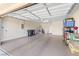 Spacious two-car garage with epoxy flooring and ample storage at 6420 Birdcall St, North Las Vegas, NV 89084