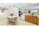 Kitchen with light wood cabinets, a breakfast nook, and open-concept design at 6420 Birdcall St, North Las Vegas, NV 89084