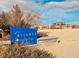 Aliante Deer Springs Park blue welcome sign situated in a sandy recreational area at 6420 Birdcall St, North Las Vegas, NV 89084