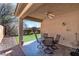 Covered patio with ceiling fan, perfect for outdoor dining at 6420 Birdcall St, North Las Vegas, NV 89084