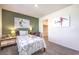 Stylish bedroom with green wall and soccer decor at 6542 Coffee Theme St # Lot 12, North Las Vegas, NV 89084