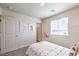 Bright bedroom with polka dot bedding and window at 6542 Coffee Theme St # Lot 12, North Las Vegas, NV 89084