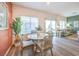 Dining area with marble table and wicker chairs, adjacent to patio at 6542 Coffee Theme St # Lot 12, North Las Vegas, NV 89084