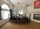 Formal dining room with fireplace and large windows at 656 Hidden Cellar Ct, Las Vegas, NV 89183