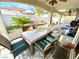 Covered patio with outdoor dining set and backyard access at 656 Hidden Cellar Ct, Las Vegas, NV 89183