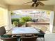 Covered patio with outdoor dining set and view of backyard at 656 Hidden Cellar Ct, Las Vegas, NV 89183