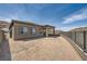 Spacious backyard featuring a covered patio and privacy fence, perfect for outdoor enjoyment at 66 Ibiza Lake Dr, Henderson, NV 89011