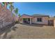 Spacious backyard with covered patio and gravel at 685 Viale Machiavelli Ln, Henderson, NV 89011