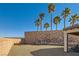 Large backyard with gravel and tall palm trees at 685 Viale Machiavelli Ln, Henderson, NV 89011