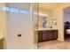 Bathroom with shower, vanity, and view of bedroom at 685 Viale Machiavelli Ln, Henderson, NV 89011