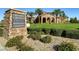 Tuscan-style clubhouse with a manicured lawn at 685 Viale Machiavelli Ln, Henderson, NV 89011