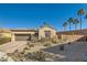 Single-story home with desert landscaping and a two-car garage at 685 Viale Machiavelli Ln, Henderson, NV 89011