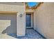 Dark gray front door with sidelights and brick walkway at 685 Viale Machiavelli Ln, Henderson, NV 89011