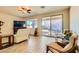 Living room with comfortable seating and sliding glass doors at 685 Viale Machiavelli Ln, Henderson, NV 89011