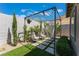 Relaxing backyard oasis with pergola, seating, and hammock at 7230 Galaxy Dune St, Las Vegas, NV 89148