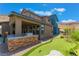 Outdoor kitchen and putting green in the backyard at 7230 Galaxy Dune St, Las Vegas, NV 89148