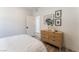 Light and airy bedroom with a dresser and built-in shelving at 7230 Galaxy Dune St, Las Vegas, NV 89148